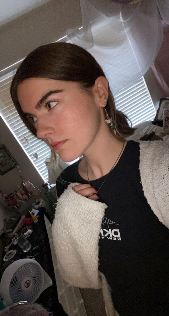 Grace two years later, in a white cardigan, skin clear
